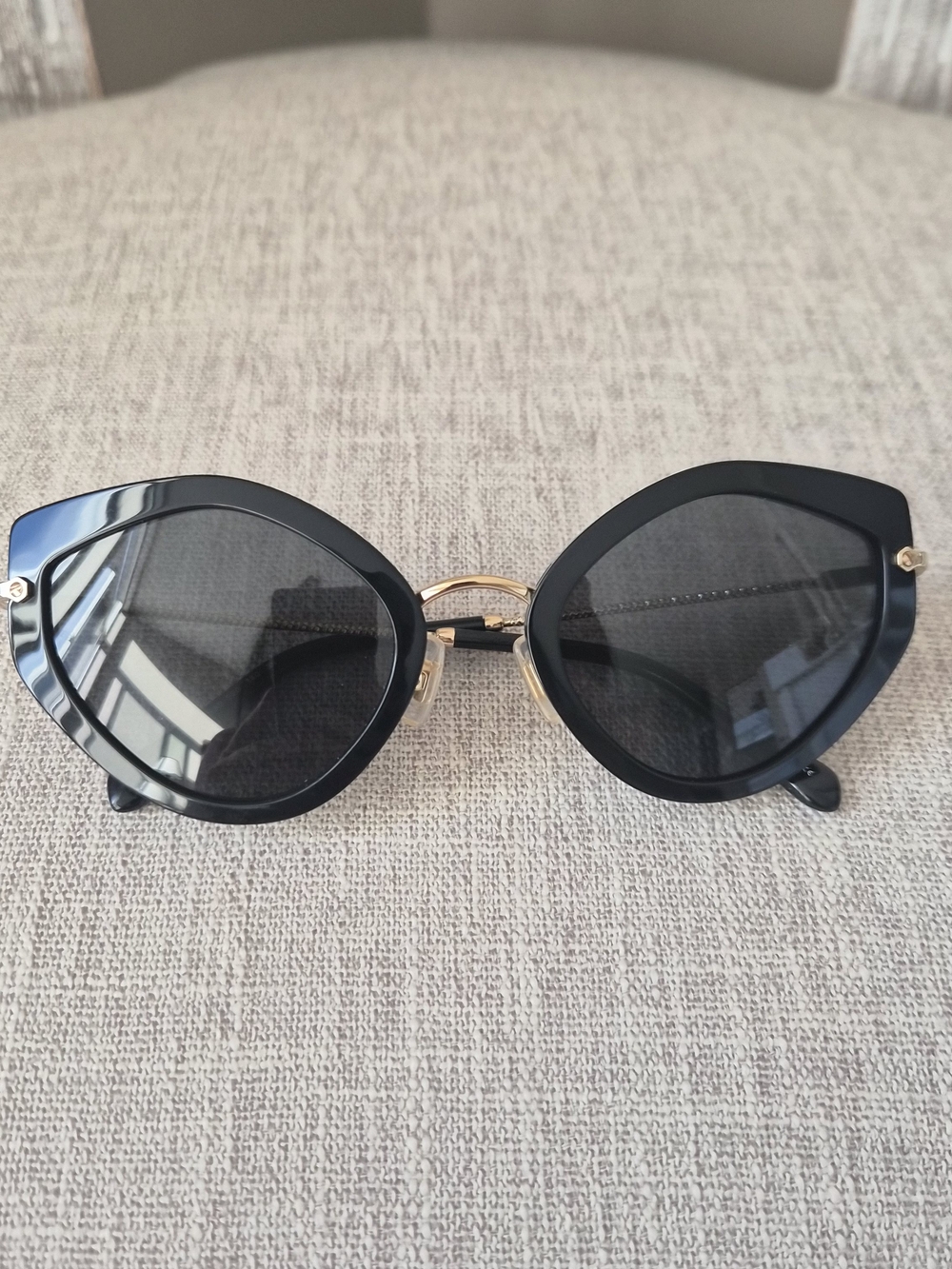 Miu Miu Black Cat-Eye Sunglasses with Gold Bridge